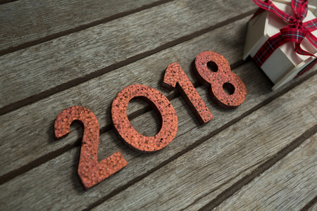 Overhead of New year 2018 with gift on wooden surface