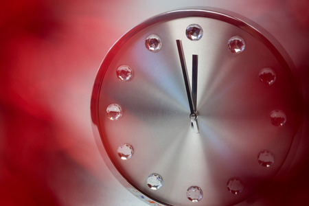 Clock hands reaching 12 clock midnight on new year 2018