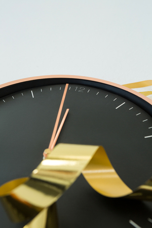 Clock hands reaching 12 clock midnight on new year 2018