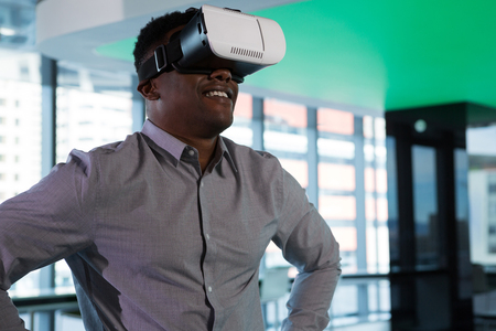 Man using virtual reality headset in futuristic office