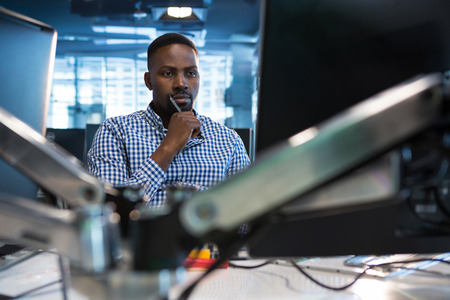 Computer engineer working at desk in office