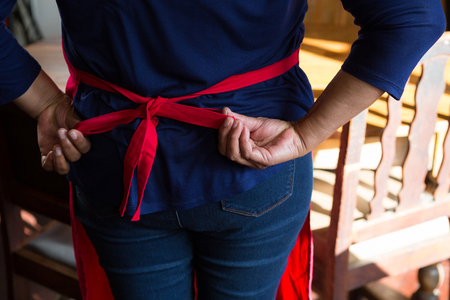 Waitress wearing her apron in the barの写真素材