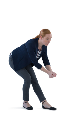 Woman pretending to hold an invisible object against white backgroundの写真素材