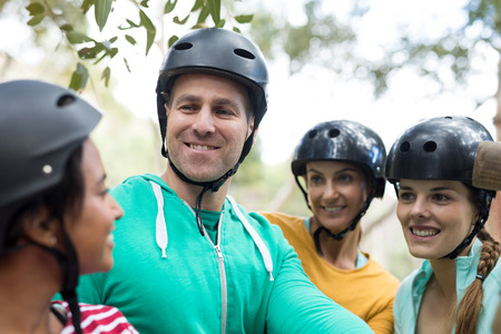 Happy friends interacting with each otherの写真素材