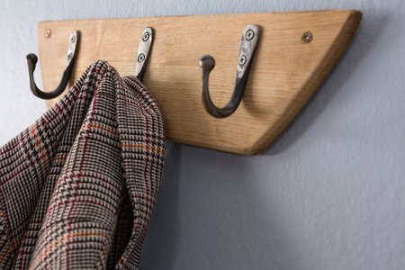 Close-up of blazer hanging on hookの写真素材