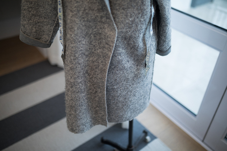 Close-up of blazer and measuring tape on mannequinの写真素材