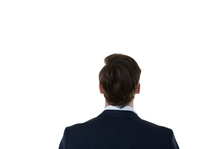 Rear view of businessman looking at invisible screenの写真素材