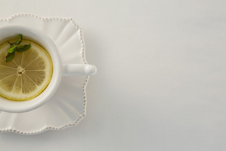 Overhead view of lemon tea in a cupの写真素材
