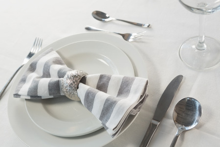 Close-up of plate and cutlery set on a table の写真素材