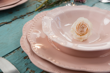 Close-up of red rose in bowl on table