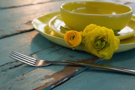 Close-up of table setting on weathered wooden plank