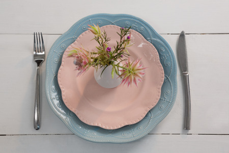 Overhead of elegance table setting on wooden plank