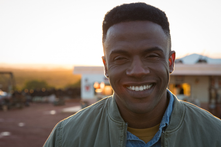 Happy man smiling on a sunny dayの写真素材