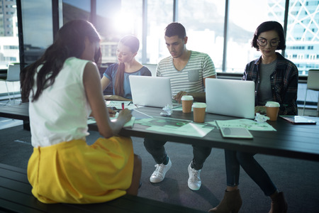 Group of executives working together in office