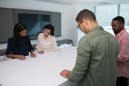 Business executives in boardroom at officeの写真素材
