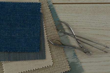 Close-up of textile and tools on a table