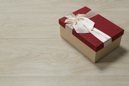 Close-up of gift box on a wooden tableの写真素材