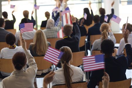 Front view of young African american businesswoman doing speech and celebrating victory in...