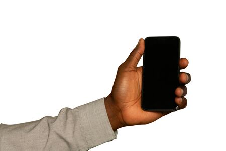 Close up of the hand of a young African American man holding a smartphone