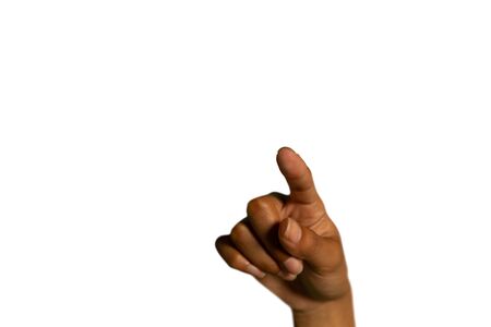 Close up of the hand of a young mixed race woman with finger outstretched towards the camera, pointing or touchingの写真素材