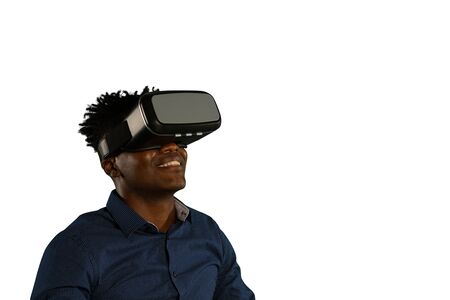 Front view close up of a young African American man wearing a dark blue shirt and a VR headset,...