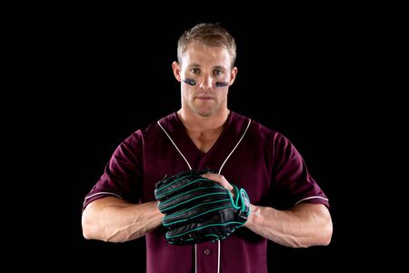 Portrait close up of a Caucasian male baseball player, a pitcher or fielder wearing a team uniform,...