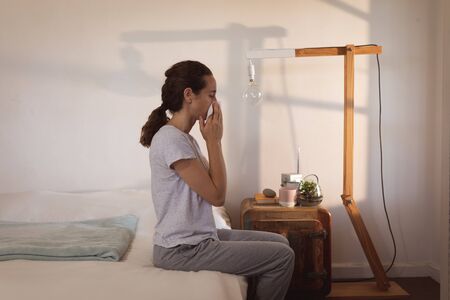Caucasian woman spending time at home self isolating and social distancing in quarantine lockdown...