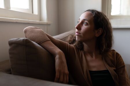 Caucasian woman spending time at home self isolating and social distancing in quarantine lockdown...