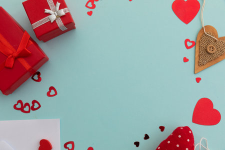 High angle view of red presents and hearts on blue background. valentine's day romance love gift copy space concept.の写真素材