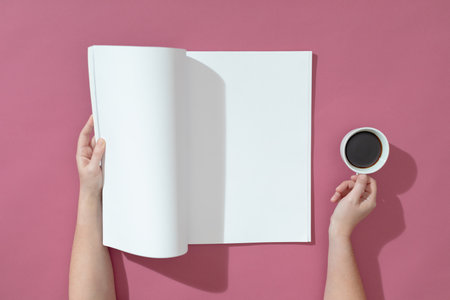 Composition of caucasian woman holding opened book with blank pages and coffee on pink. reading,...