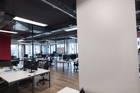 Interior of empty modern office with desks and computers. modern office of a creative design...