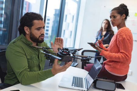 Diverse group of creative colleagues talking at meeting. modern office of a creative design business.の写真素材