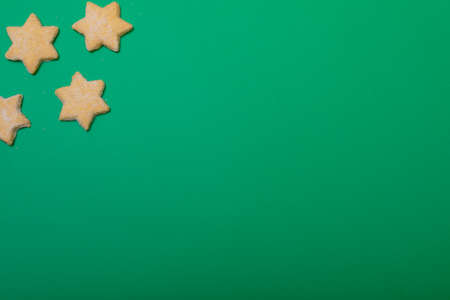 Composition of christmas cookies and copy space on green background. christmas, tradition and celebration concept.の写真素材