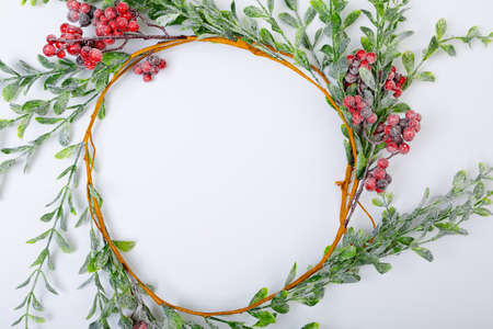 Composition of tree branches with berries and copy space on white background. christmas, tradition and celebration concept.の写真素材