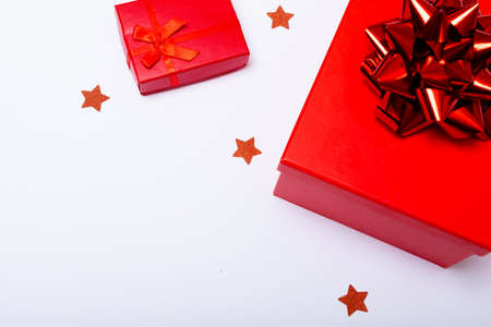 Composition of red presents with stars and copy space on white background. christmas, tradition and...