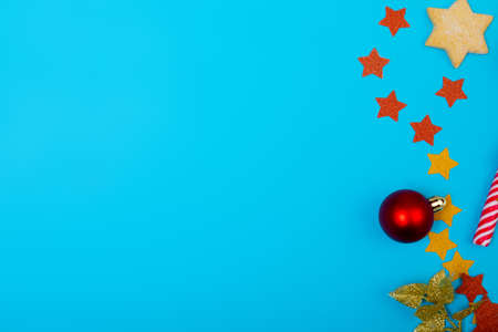 Composition of christmas decorations with red bauble and copy space on blue background. christmas, tradition and celebration concept.の写真素材