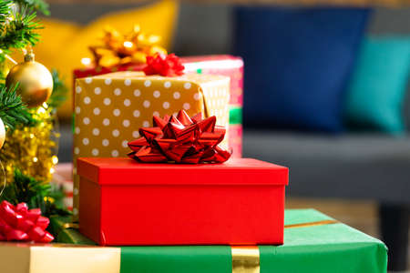Composition of christmas tree and stack of presents on blurred background. christmas, tradition and...