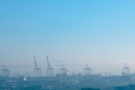 General view of cityscape with multiple modern buildings and cranes in the morning. skyline and urban architecture.の写真素材