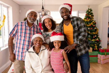 Happy multi generation family wearing santa hats, taking photo. family christmas time and festivity...