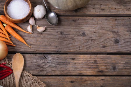 Close up of multiple food ingredients and cutlery with copy space on wooden surface. food and restaurant conceptの写真素材