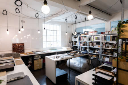 Interior of illuminated light bulbs hanging from ceiling in creative office. unaltered, business and...