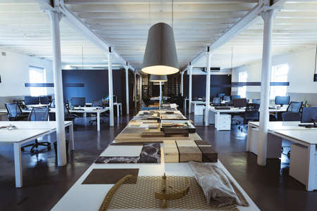 Interior of modern creative office with fabrics and frames on table. unaltered, business, modern...