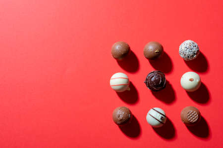 Directly above shot of dessert arranged on red background, copy space. valentine&#39;s day, food and love concept.の写真素材