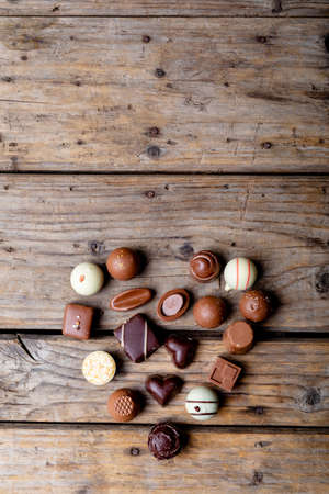 Directly above shot of chocolates arranged in heart shape with copy space on table. valentine&#39;s day, sweet food and love concept.の写真素材