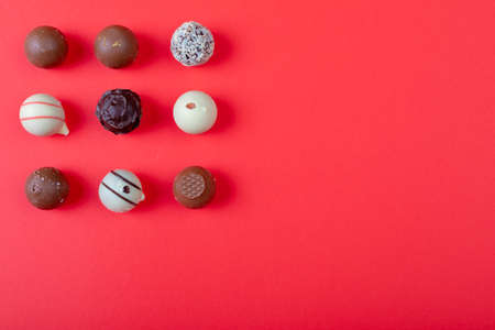 Overhead view of dessert arranged on red background, copy space. valentine's day, food and love concept.の写真素材