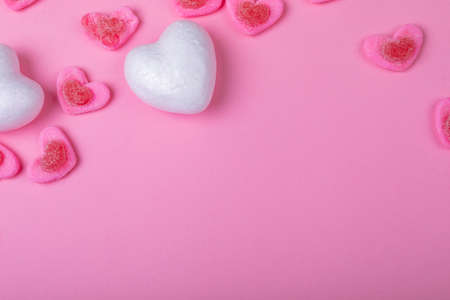 Overhead view of heart shaped sweet food on pink background, copy space. valentine's day, food...