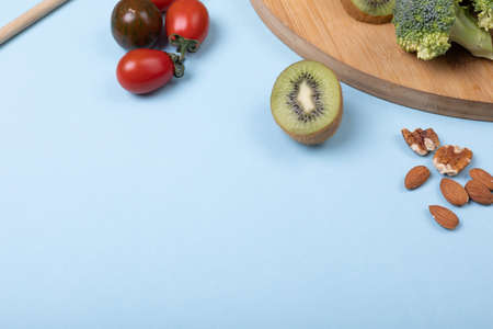 High angle view of fruits and vegetables over blue background, copy space. unaltered, food, organic,...