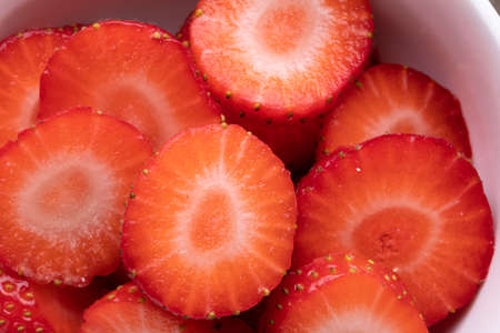 Full frame shot of sliced fresh red strawberries with copy space. unaltered, berry fruit, organic,...