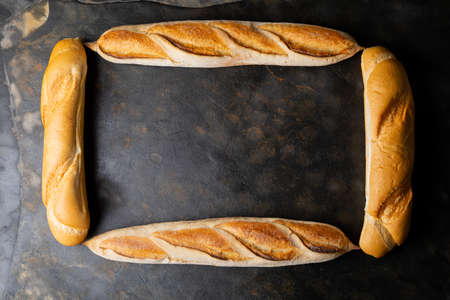 Directly above shot of baguettes arranged in rectangle on table. unaltered, healthy food, copy...