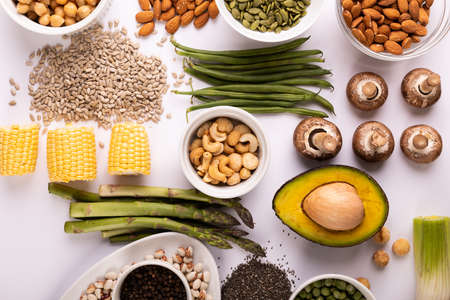 Overhead view of healthy food and ingredients arranged on white table, copy space. unaltered, food, preparation, healthy eating.の写真素材